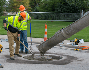 New Bremen Repair - two guys working with concrete