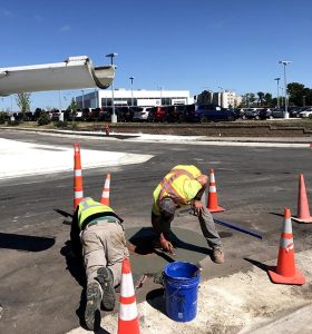 Men working over manhole