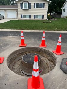 Traffic cones around a manhole